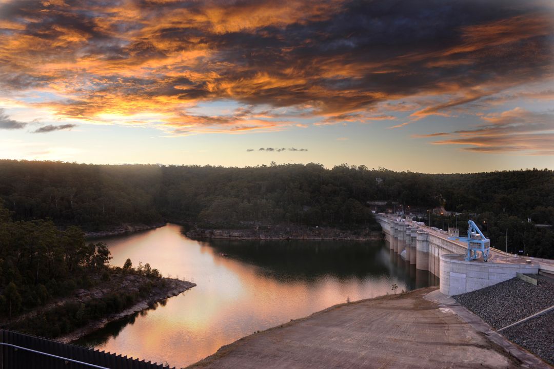 Sunset over lake and dam